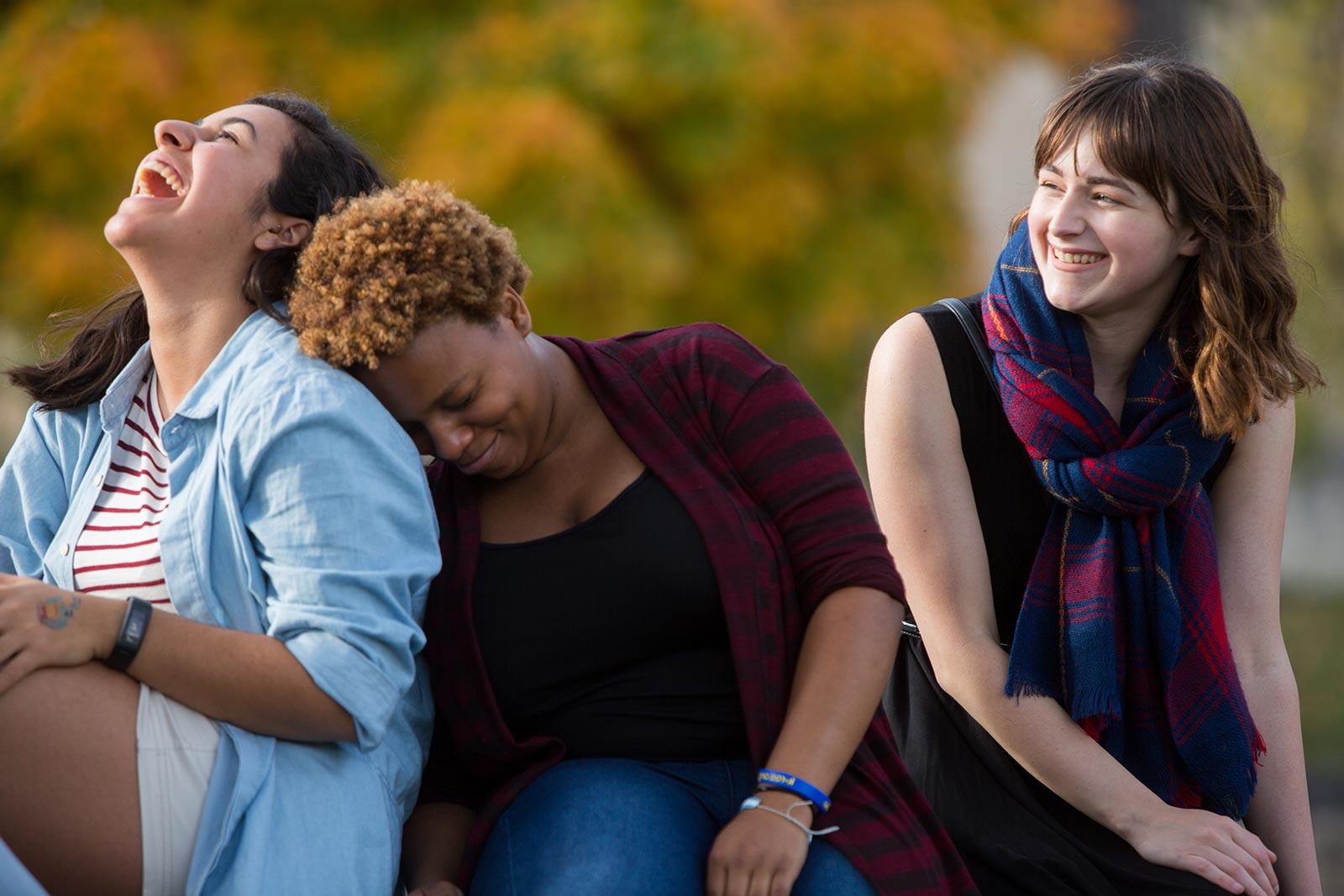 students sitting and laughing with each other